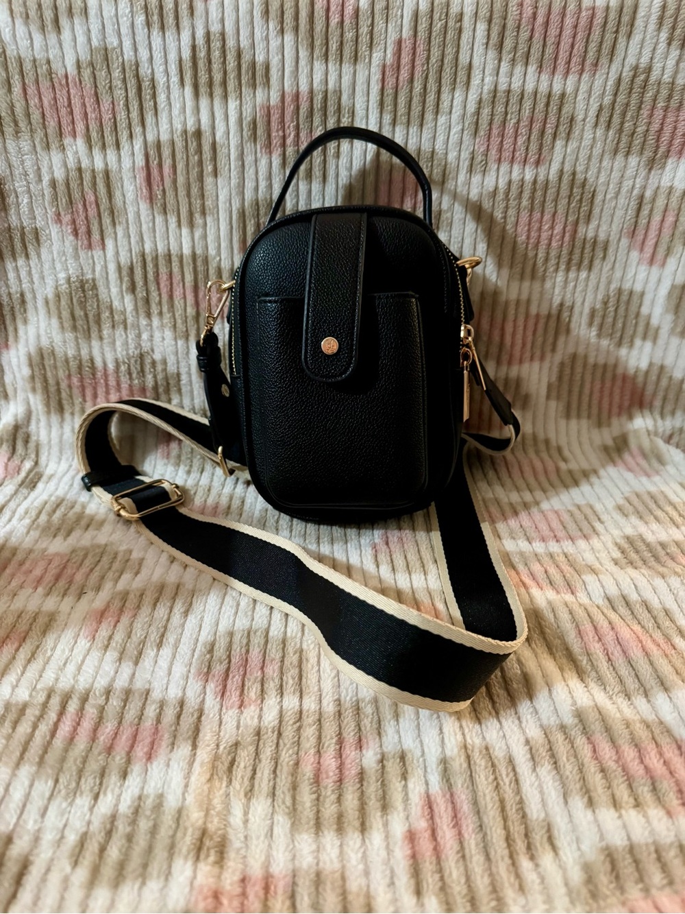Compact Black Crossbody Bag with Contrast Strap and Gold Accents